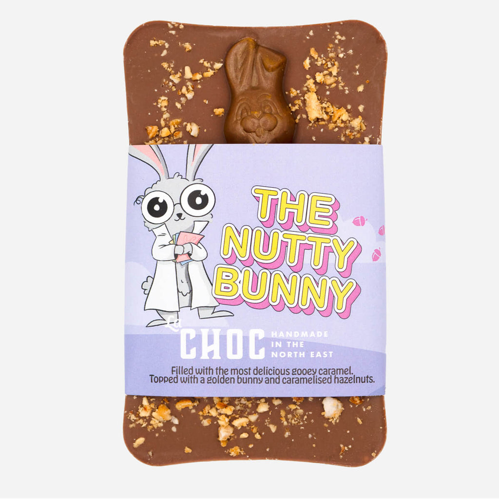 The Nutty Bunny chocolate bar by La Choc, topped with a golden bunny and caramelised hazelnuts on a smooth milk chocolate base.